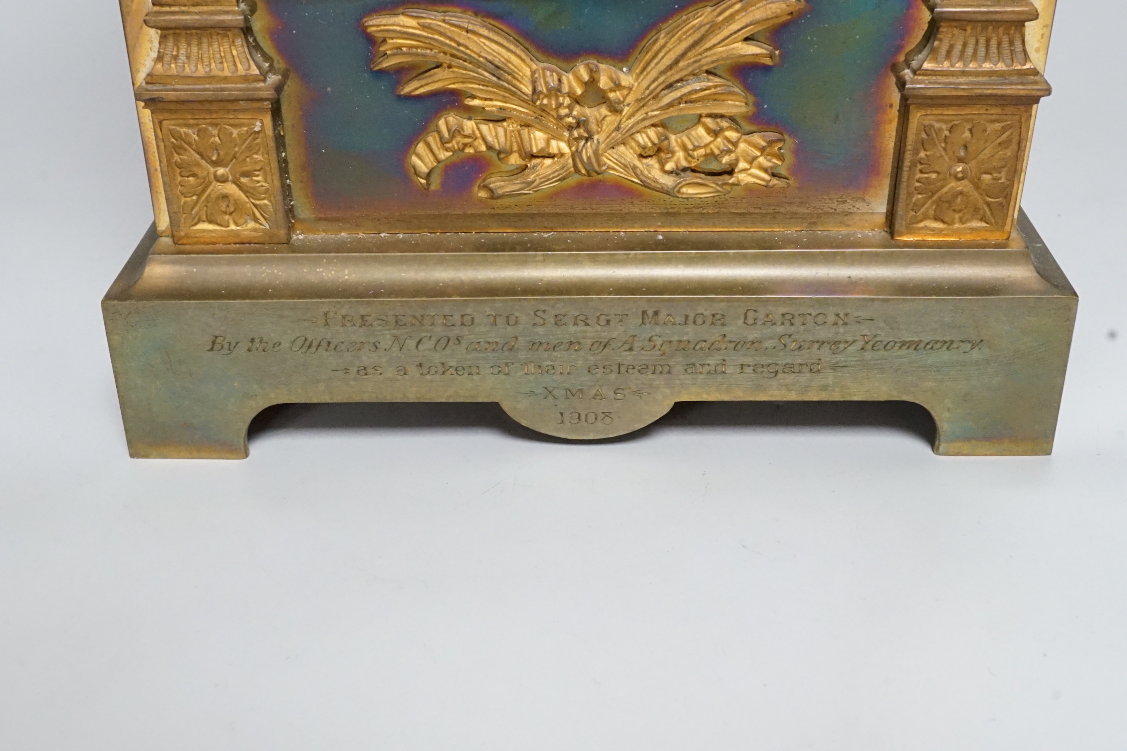 A French ormolu mounted brass architectural mantel clock with Surrey Yeomanry 1908 inscription, 29cm